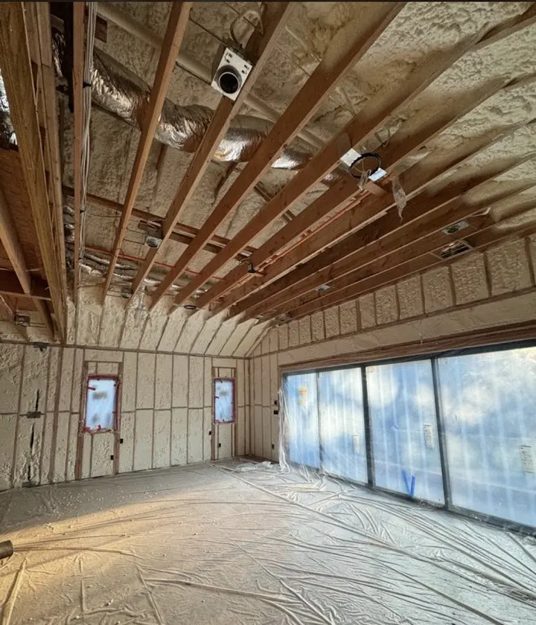 Interior walls and ceiling insulated with spray foam during new construction in Millbury